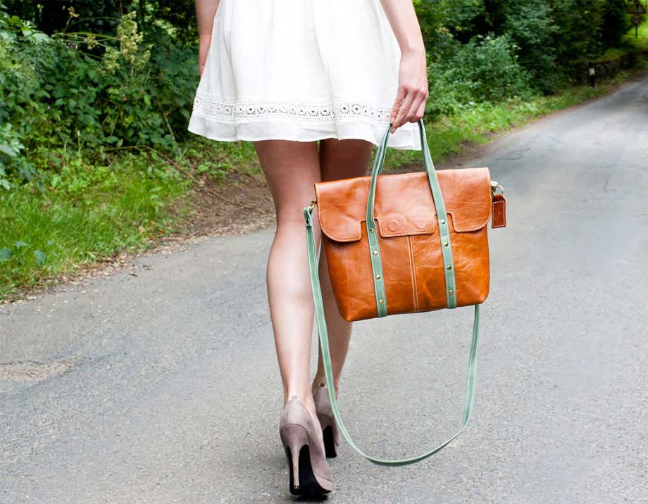Young woman with shopping bags in a beautiful dress